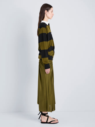 Proenza Schouler Side full length image of model wearing Naia Skirt in Viscose Satin Jersey in Moss