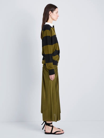 Proenza Schouler Side full length image of model wearing Naia Skirt in Viscose Satin Jersey in Moss