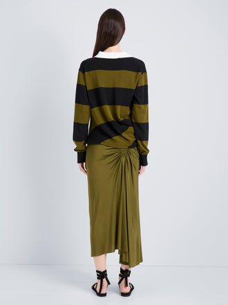Proenza Schouler Back full length image of model wearing Naia Skirt in Viscose Satin Jersey in Moss