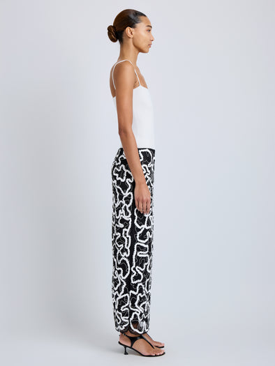 Proenza Schouler Side full length image of model wearing Maite Skirt in Sequin Embroidery Lace in White Multi