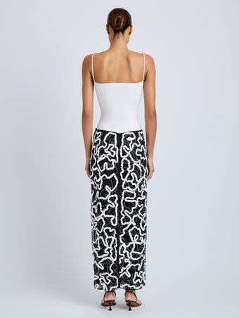 Proenza Schouler Back full length image of model wearing Maite Skirt in Sequin Embroidery Lace in White Multi
