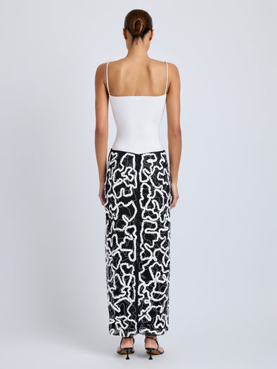Proenza Schouler Back full length image of model wearing Maite Skirt in Sequin Embroidery Lace in White Multi