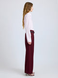 Proenza Schouler Side full length image of model wearing Halima Pant in Wool Gabardine in Oxblood
