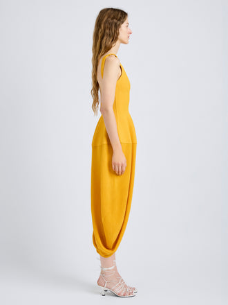 Proenza Schouler Side full length image of model wearing Sukki Dress in Draped Viscose in Marigold
