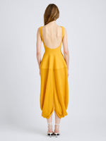Proenza Schouler Back full length image of model wearing Sukki Dress in Draped Viscose in Marigold