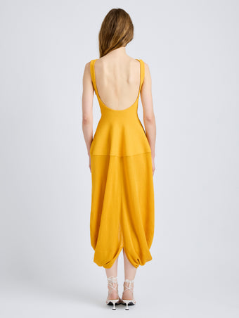 Proenza Schouler Back full length image of model wearing Sukki Dress in Draped Viscose in Marigold