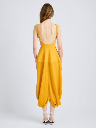 Proenza Schouler Back full length image of model wearing Sukki Dress in Draped Viscose in Marigold