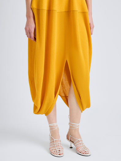 Proenza Schouler Detail image of model wearing Sukki Dress in Draped Viscose in Marigold