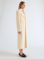 Proenza Schouler Side full length image of model wearing Alix Coat in Compact Melton Wool in Ivory