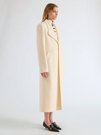 Proenza Schouler Side full length image of model wearing Alix Coat in Compact Melton Wool in Ivory