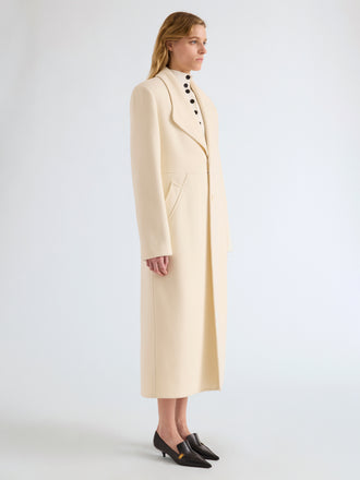 Proenza Schouler Side full length image of model wearing Alix Coat in Compact Melton Wool in Ivory