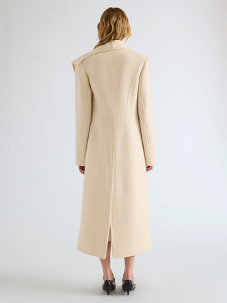 Proenza Schouler Back full length image of model wearing Alix Coat in Compact Melton Wool in Ivory