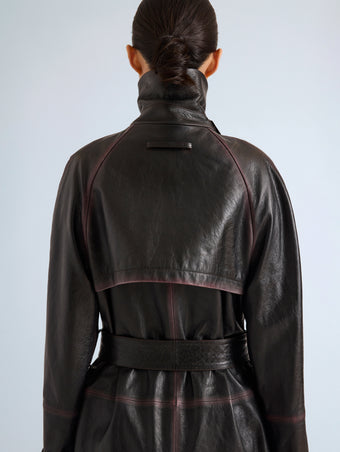 Proenza Schouler Detail image of model wearing Kasia Coat in Burnished Leather in Amarone Black