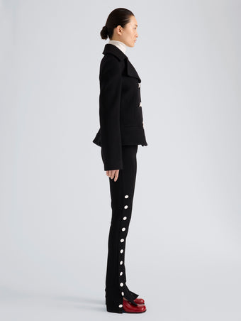 Proenza Schouler Side full length image of model wearing Romane Jacket in Compact Melton Wool in Black
