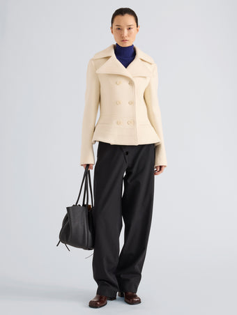 Proenza Schouler Front full length image of model wearing Romane Jacket in Compact Melton Wool in Ivory