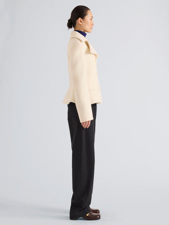 Proenza Schouler Side full length image of model wearing Romane Jacket in Compact Melton Wool in Ivory