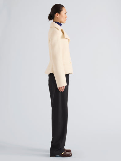 Proenza Schouler Side full length image of model wearing Romane Jacket in Compact Melton Wool in Ivory