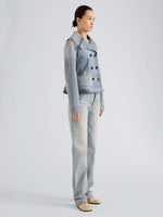 Proenza Schouler Side full length image of model wearing Romane Jacket in Rigid Denim in Light Vintage Blue Wash