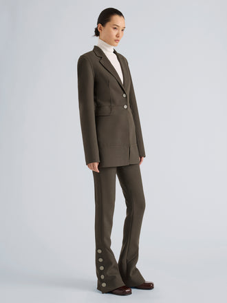 Proenza Schouler Side full length image of model wearing Maera Jacket in Bi-Stretch Double Wool in Earth