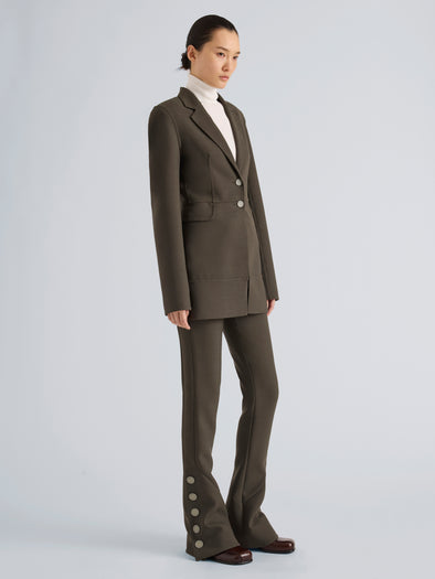 Proenza Schouler Side full length image of model wearing Maera Jacket in Bi-Stretch Double Wool in Earth
