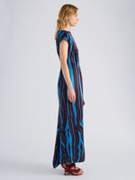 Proenza Schouler Side full length image of model wearing Isoria Dress in Twisted Stripe Satin Jacquard in Cyan Amarone