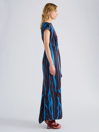 Proenza Schouler Side full length image of model wearing Isoria Dress in Twisted Stripe Satin Jacquard in Cyan Amarone