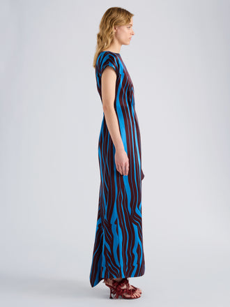 Proenza Schouler Side full length image of model wearing Isoria Dress in Twisted Stripe Satin Jacquard in Cyan Amarone