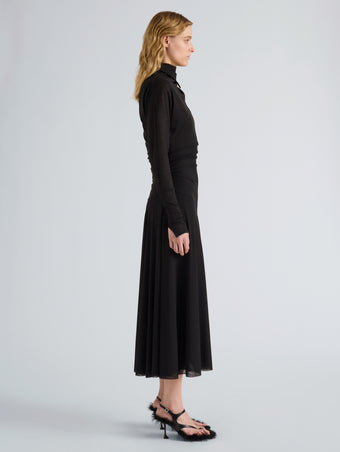 Proenza Schouler Side full length image of model wearing Golda Dress in Textured Sheer Jersey in Black