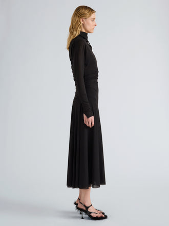 Proenza Schouler Side full length image of model wearing Golda Dress in Textured Sheer Jersey in Black
