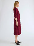 Proenza Schouler Side full length image of model wearing Alin Dress in Crushed Silk in Wine