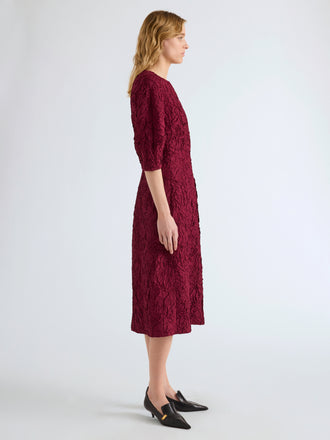 Proenza Schouler Side full length image of model wearing Alin Dress in Crushed Silk in Wine
