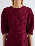 Proenza Schouler Detail image of model wearing Alin Dress in Crushed Silk in Wine
