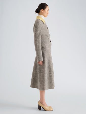 Proenza Schouler Side full length image of model wearing Gaelle Skirt in Double Face Melange Outerwear in Ecru Tahini Multi