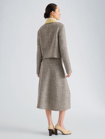 Proenza Schouler Back full length image of model wearing Gaelle Skirt in Double Face Melange Outerwear in Ecru Tahini Multi