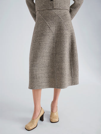 Proenza Schouler Detail image of model wearing Gaelle Skirt in Double Face Melange Outerwear in Ecru Tahini Multi