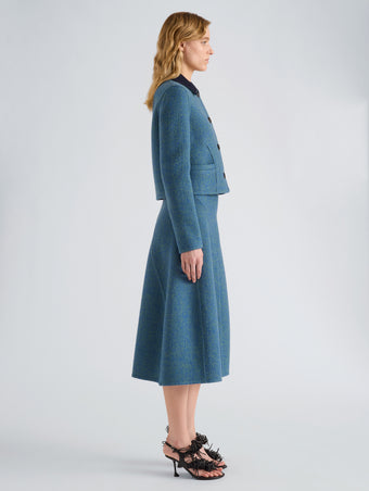Proenza Schouler Side full length image of model wearing Gaelle Skirt in Double Face Melange Outerwear in Green Midnight Multi