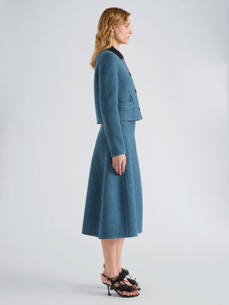 Proenza Schouler Side full length image of model wearing Gaelle Skirt in Double Face Melange Outerwear in Green Midnight Multi
