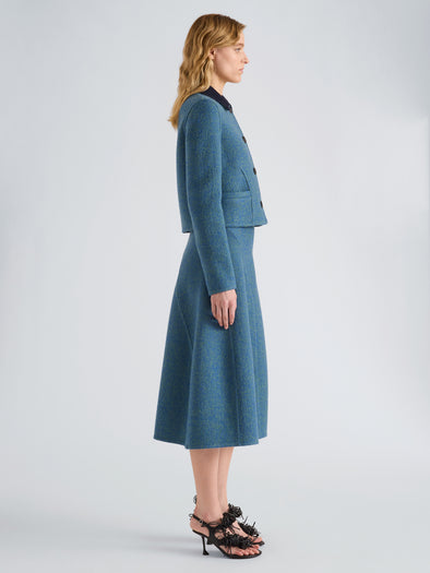 Proenza Schouler Side full length image of model wearing Gaelle Skirt in Double Face Melange Outerwear in Green Midnight Multi