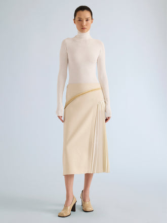Proenza Schouler Front full length image of model wearing Justine Skirt in Bonded Wool Satin in Off White Tahini