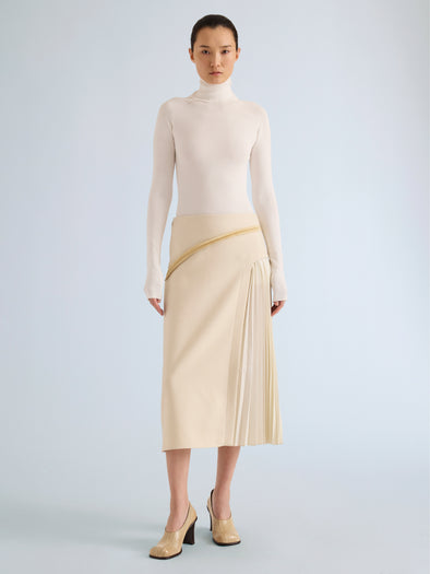 Proenza Schouler Front full length image of model wearing Justine Skirt in Bonded Wool Satin in Off White Tahini