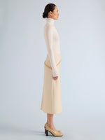 Proenza Schouler Side full length image of model wearing Justine Skirt in Bonded Wool Satin in Off White Tahini