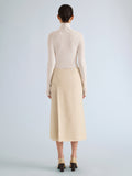 Proenza Schouler Back full length image of model wearing Justine Skirt in Bonded Wool Satin in Off White Tahini