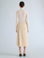 Proenza Schouler Back full length image of model wearing Justine Skirt in Bonded Wool Satin in Off White Tahini