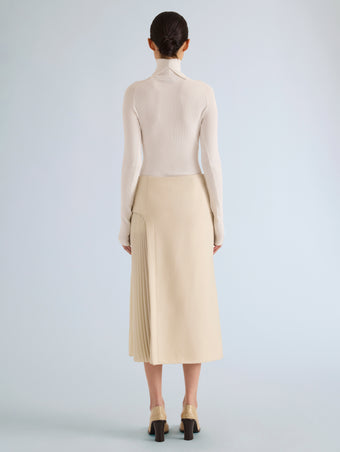 Proenza Schouler Back full length image of model wearing Justine Skirt in Bonded Wool Satin in Off White Tahini
