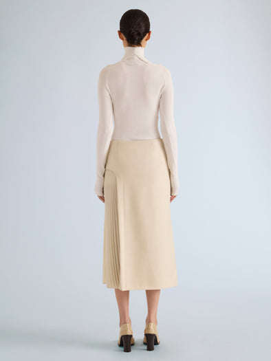 Proenza Schouler Back full length image of model wearing Justine Skirt in Bonded Wool Satin in Off White Tahini