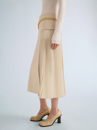 Proenza Schouler Detail image of model wearing Justine Skirt in Bonded Wool Satin in Off White Tahini