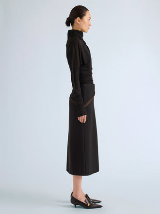 Proenza Schouler Side full length image of model wearing Justine Skirt in Bonded Wool Satin in Black Mink