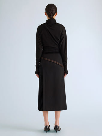 Proenza Schouler Back full length image of model wearing Justine Skirt in Bonded Wool Satin in Black Mink