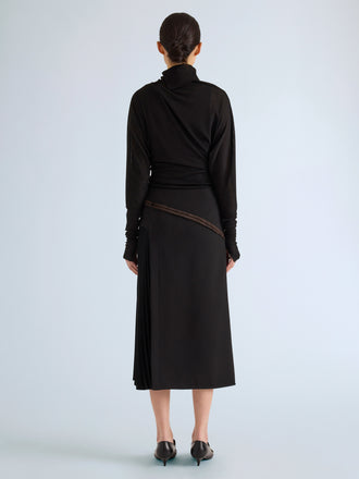 Proenza Schouler Back full length image of model wearing Justine Skirt in Bonded Wool Satin in Black Mink