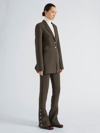 Proenza Schouler Side full length image of model wearing Althea Pant in Bi-Stretch Double Wool in Earth